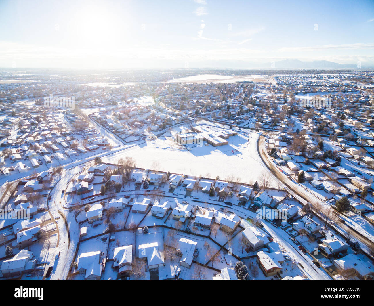 Aerial view of residential neighborhood covered in snow Stock Photo - Alamy