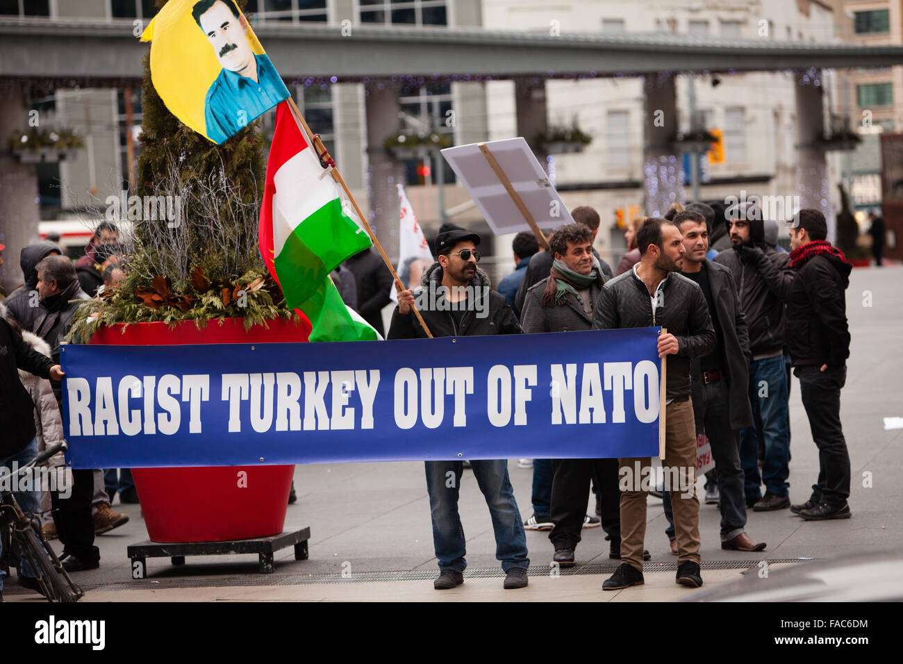 Kurdish Canadians holding 'Racist Turkey out of NATO' banner, protesting against Turkish politics towards Kurds Stock Photo