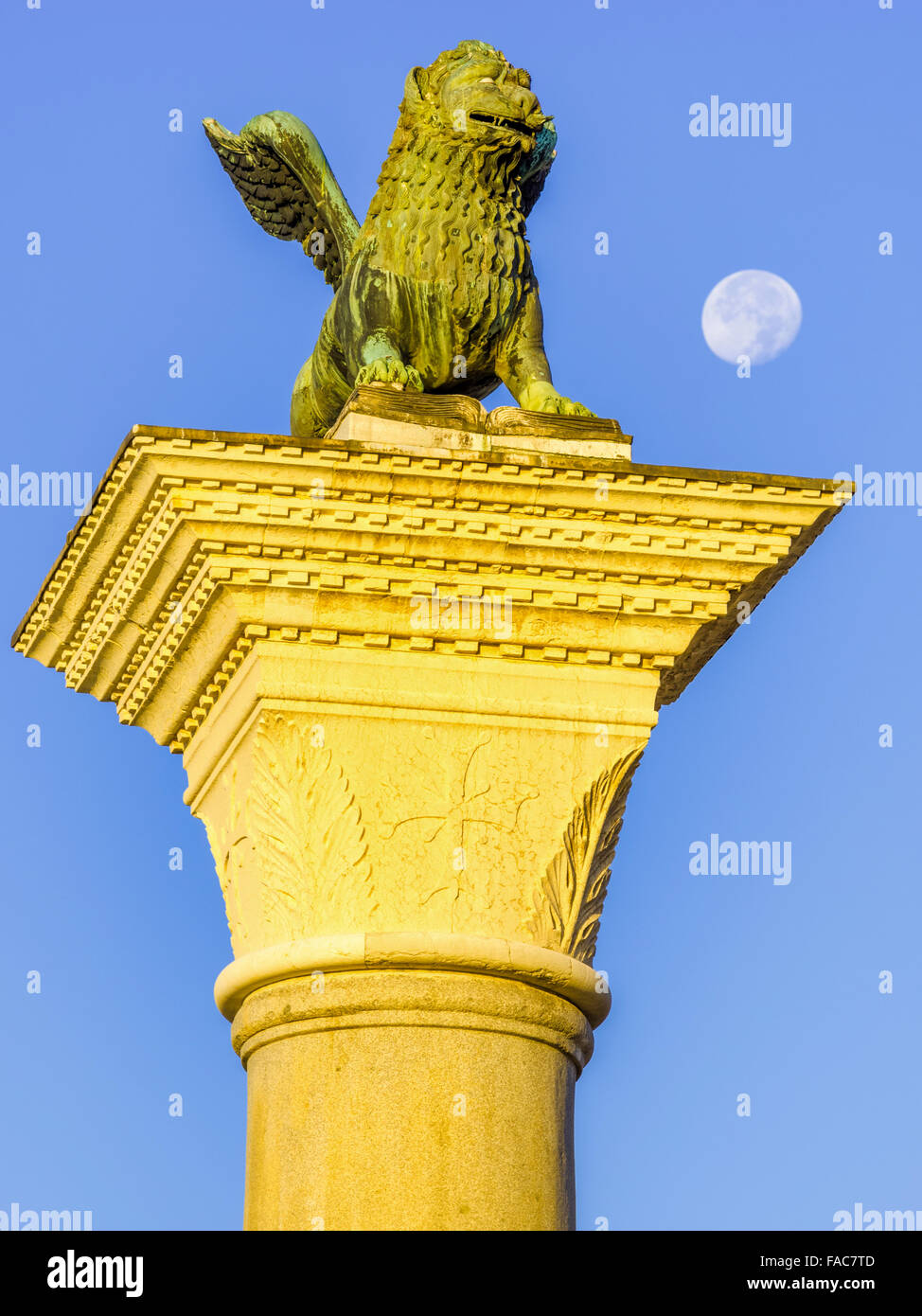 Lion of Venice statue with moon set in San Marco Square in Venice