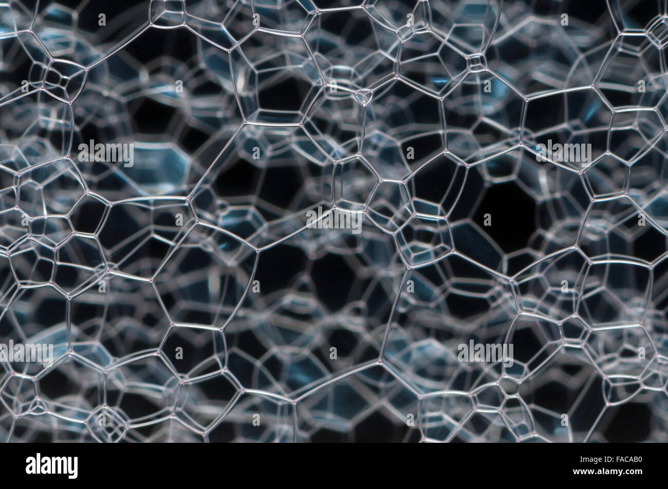 Beautiful white glass lattice, over a dark background Stock Photo - Alamy