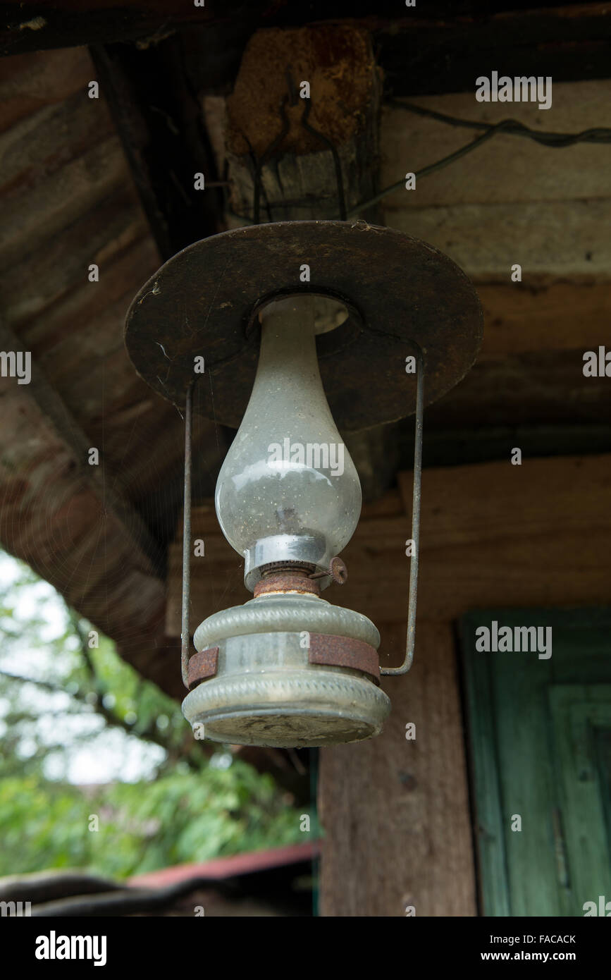 old oil lamp hanging outside a house Stock Photo