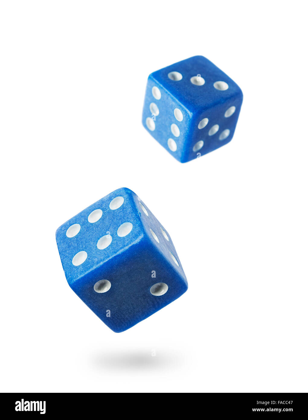 Two blue gambling dices falling down isolated on white .Local focus Stock Photo