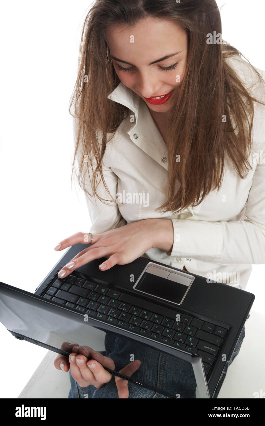 Beautiful girl with a laptop on a white background Stock Photo - Alamy