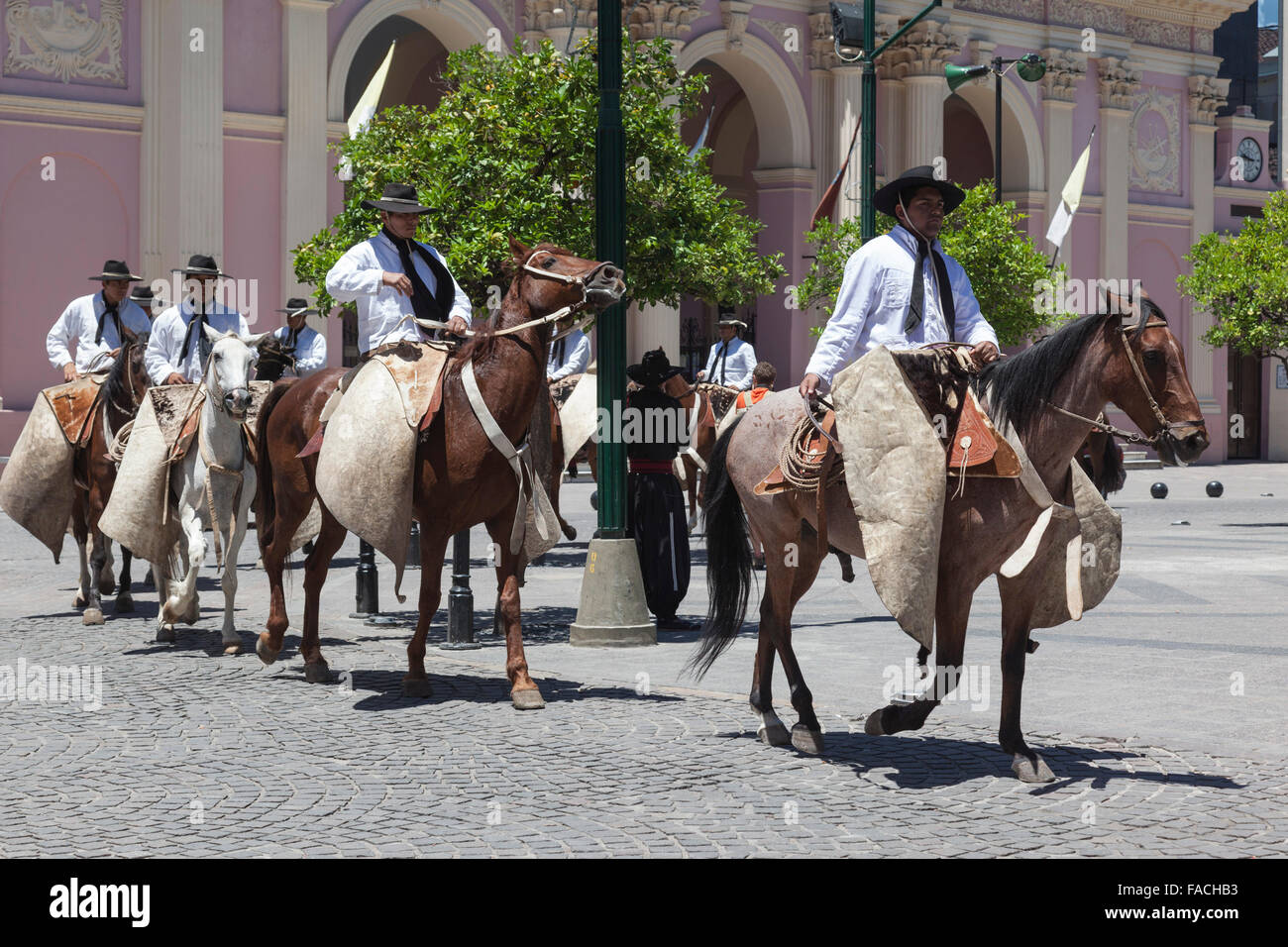 Gauchos on horseback in the town centre of Salta, Argentina Stock Photo