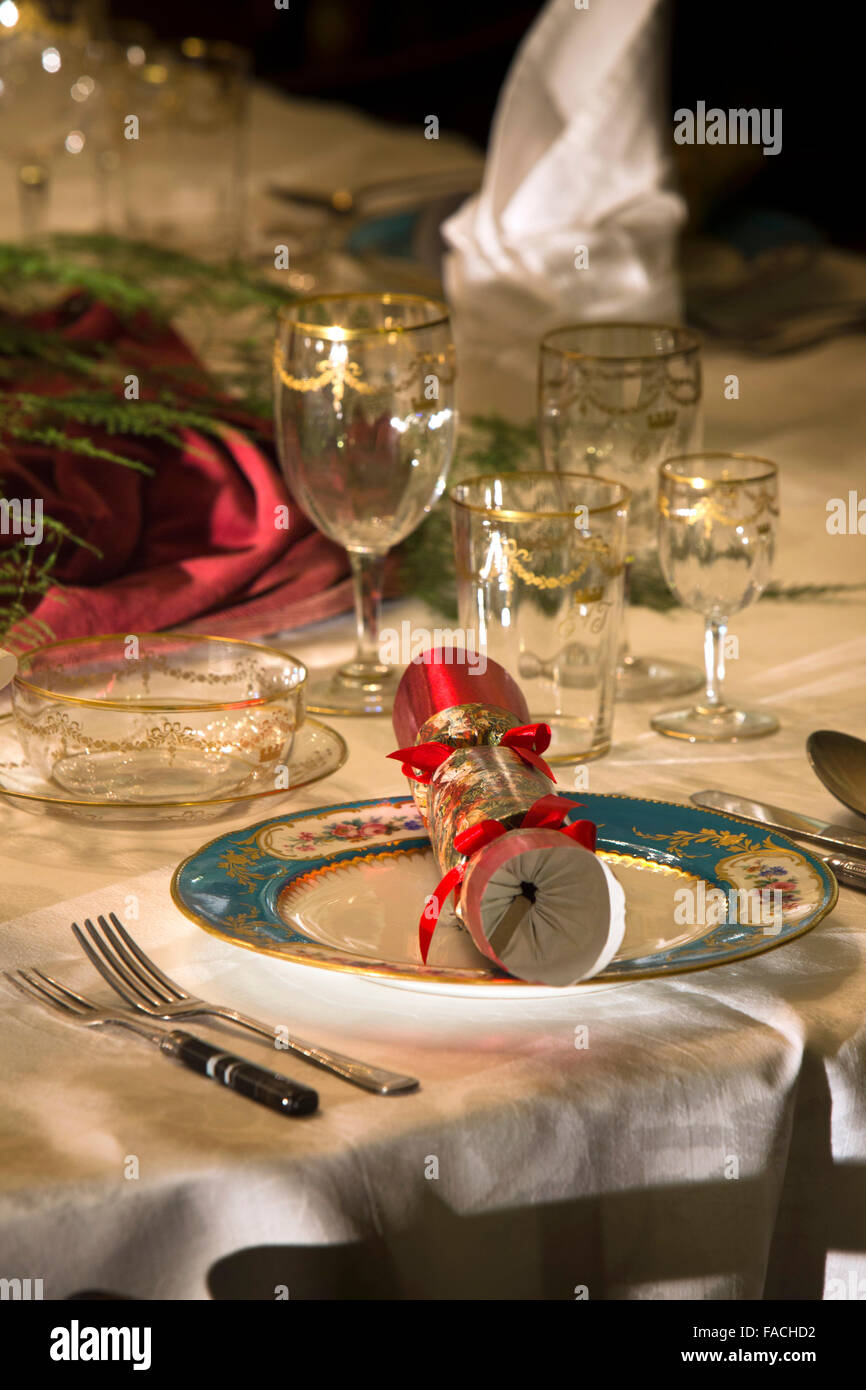 UK, England, Cheshire, Knutsford, Tatton Hall, Christmas decorations in the Dining Room, cracker on place setting Stock Photo