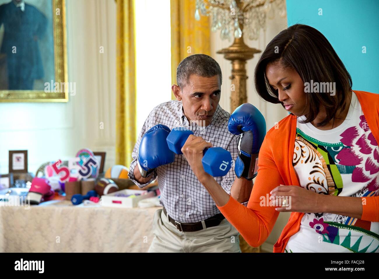 U.S President Barack Obama jokes with First Lady Michelle Obama for the  Instagram photo booth in the East Room of the White House prior to the  annual Easter Egg Roll April 6,