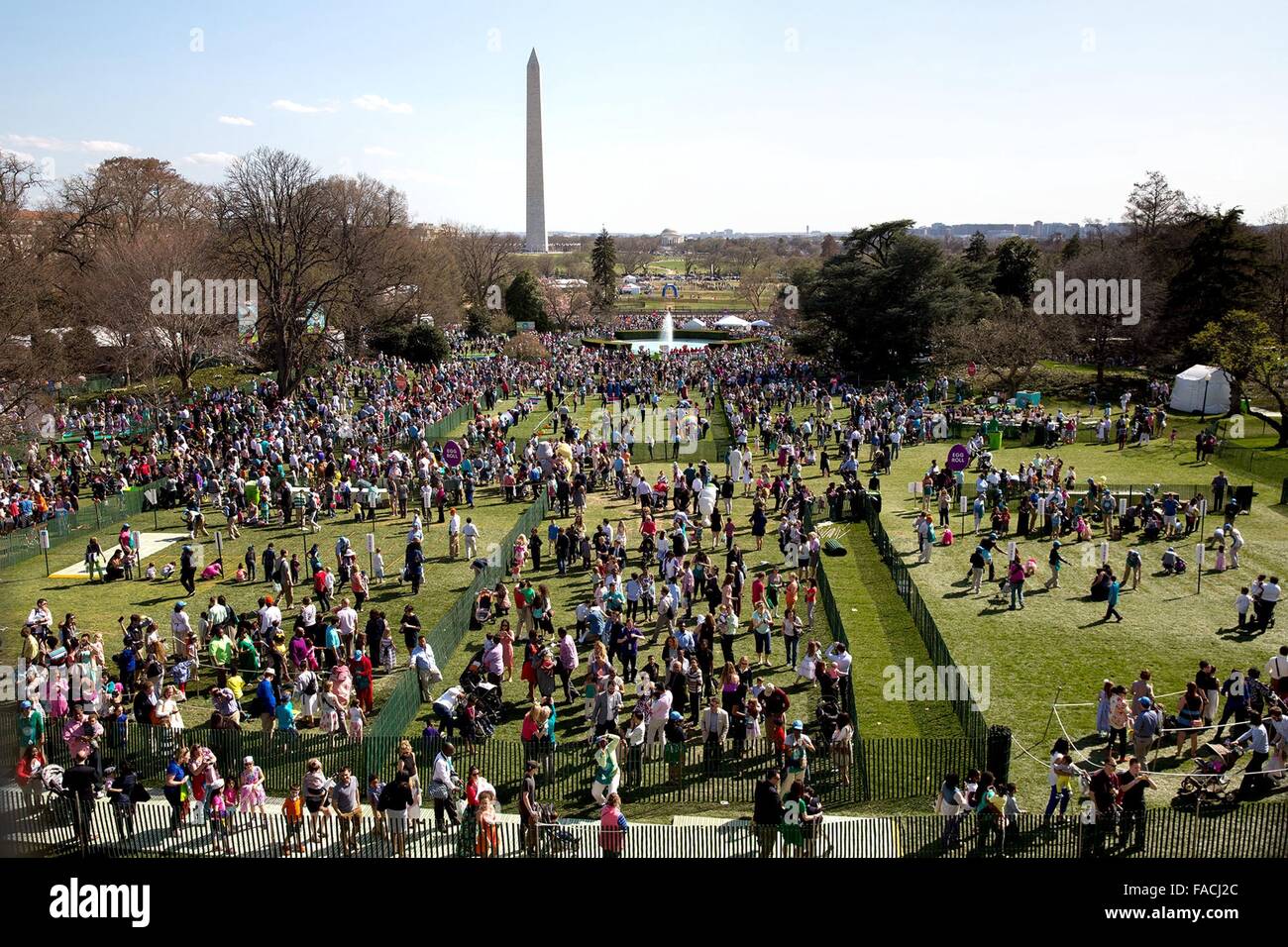 Thousands of people gather for the annual Easter Egg Roll on the South Lawn of the White House April 6, 2015 in Washington, DC. Stock Photo