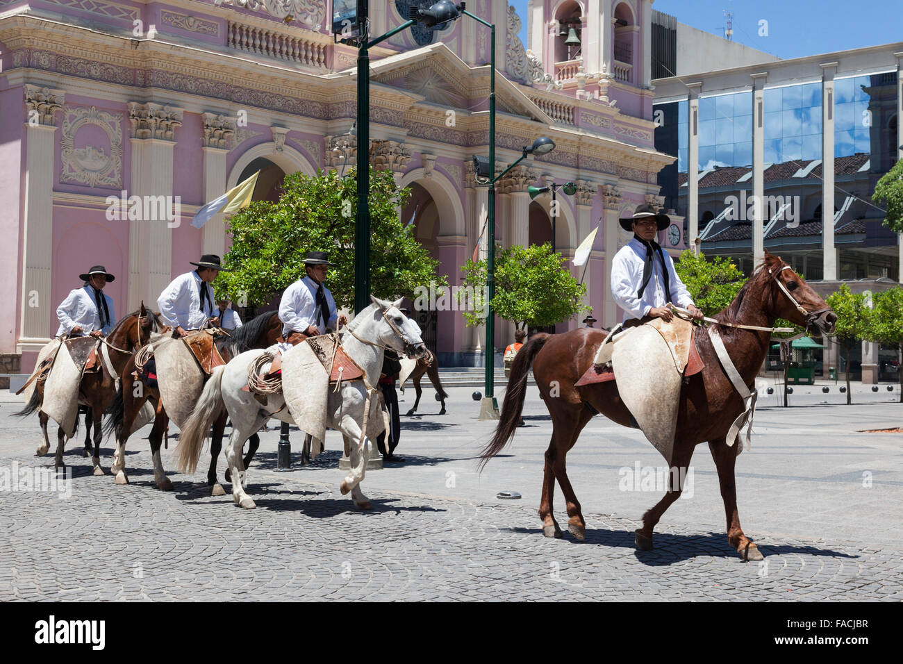 Gauchos on horseback in the town centre of Salta, Argentina Stock Photo