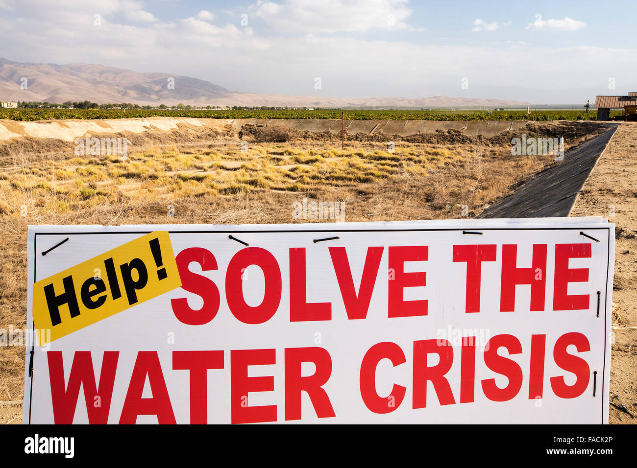 An empty farmers water hole in California's Central Valley, which is in