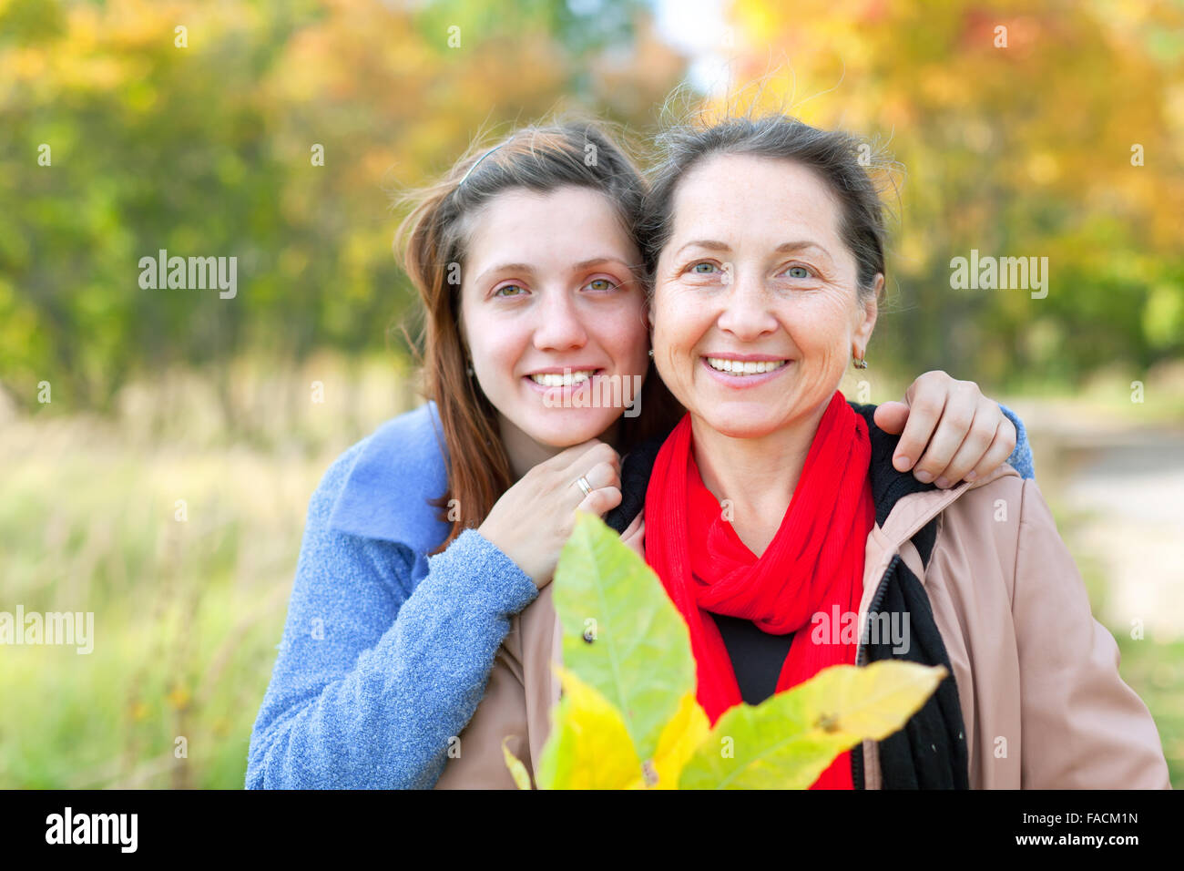 Outdoor portrait of women in autumn park Stock Photo - Alamy