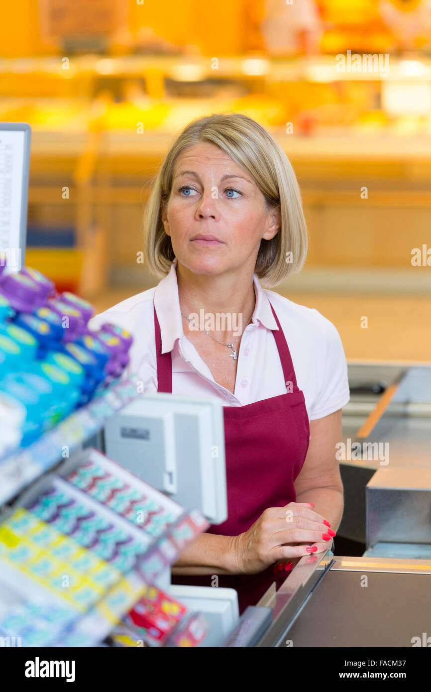 Cashier in the supermarket Stock Photo