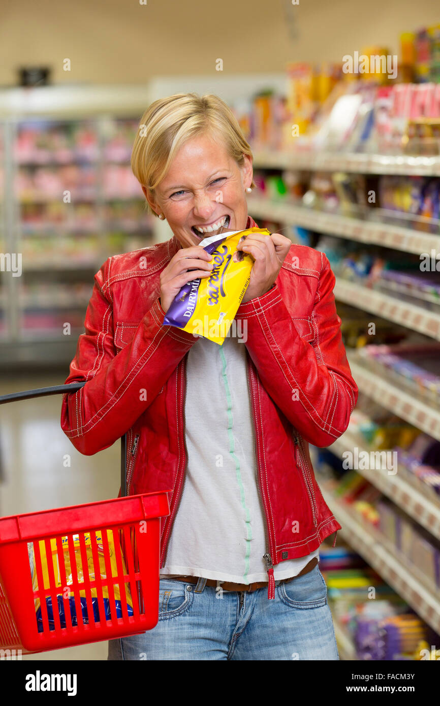 Woman eat chocolate hi-res stock photography and images - Alamy