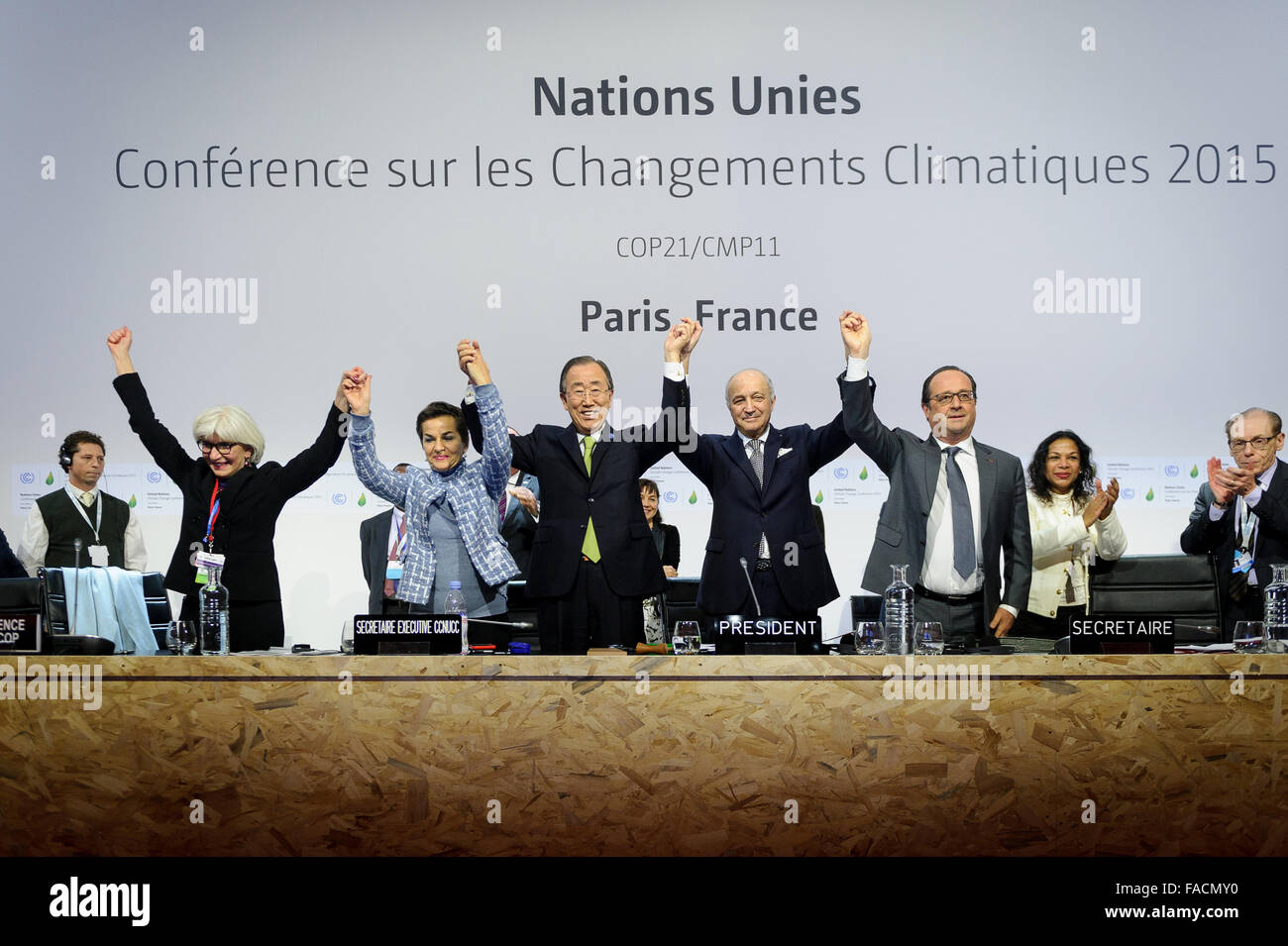 Leaders of the COP21, United Nations Climate Change Conference celebrate reaching a global agreement on greenhouse gas emissions December 12, 2015 in Le Bourget, France. (L-R) include: Special Representative Laurence Tubiana, U.N climate chief Christiana Figuere, United Nations Secretary General Ban ki-Moon, French Foreign Minister Laurent Fabius and French President Francois Hollande. Stock Photo
