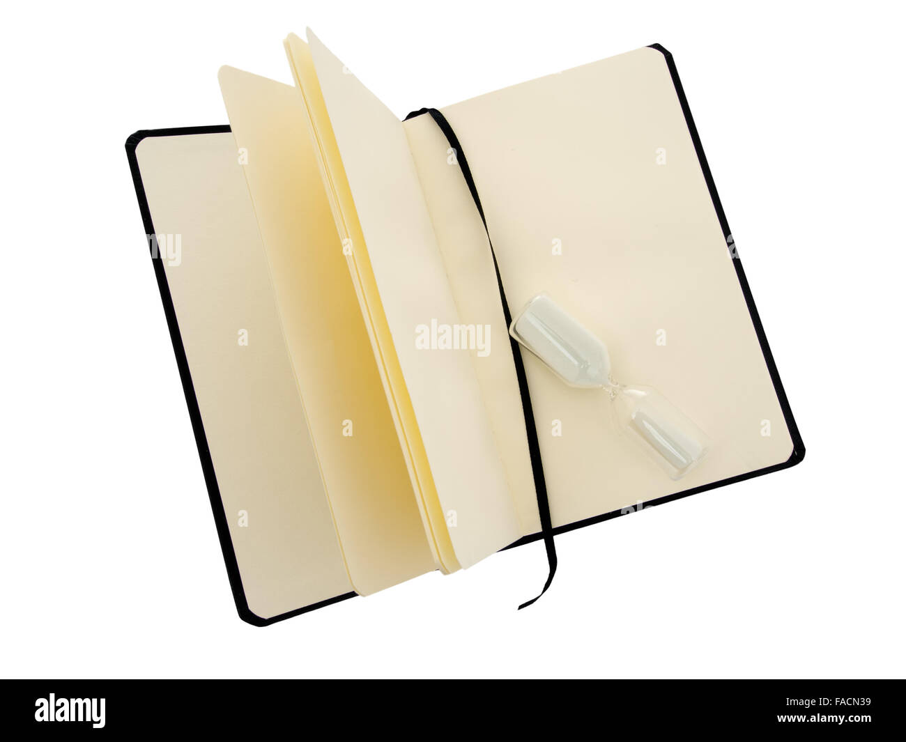 Time to write. Plain notebook with egg timer. Black cover. Isolated on white. Stock Photo