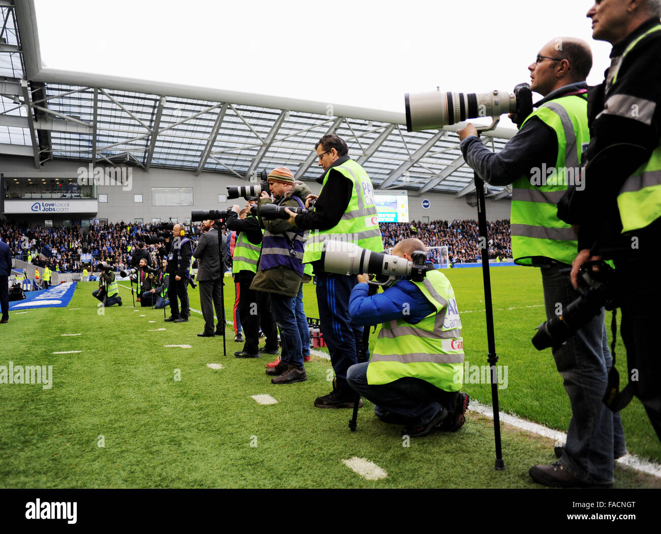 Sports photographers at a football match Stock Photo