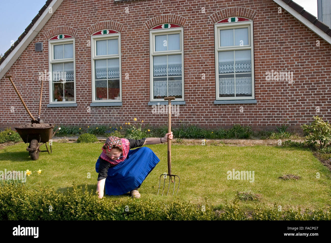 Woman in traditional clothes , the red top means that she is not in