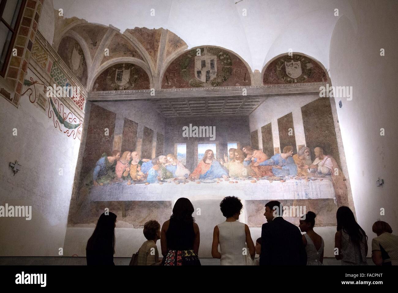 US First Lady Michelle Obama views Leonardo da Vinci's 'The Last Supper' with Prime Minister Matteo Renzi, wife Agnese Landini and their families at the Church of Santa Maria delle Grazie June 18, 2015 in Milan, Italy. Stock Photo