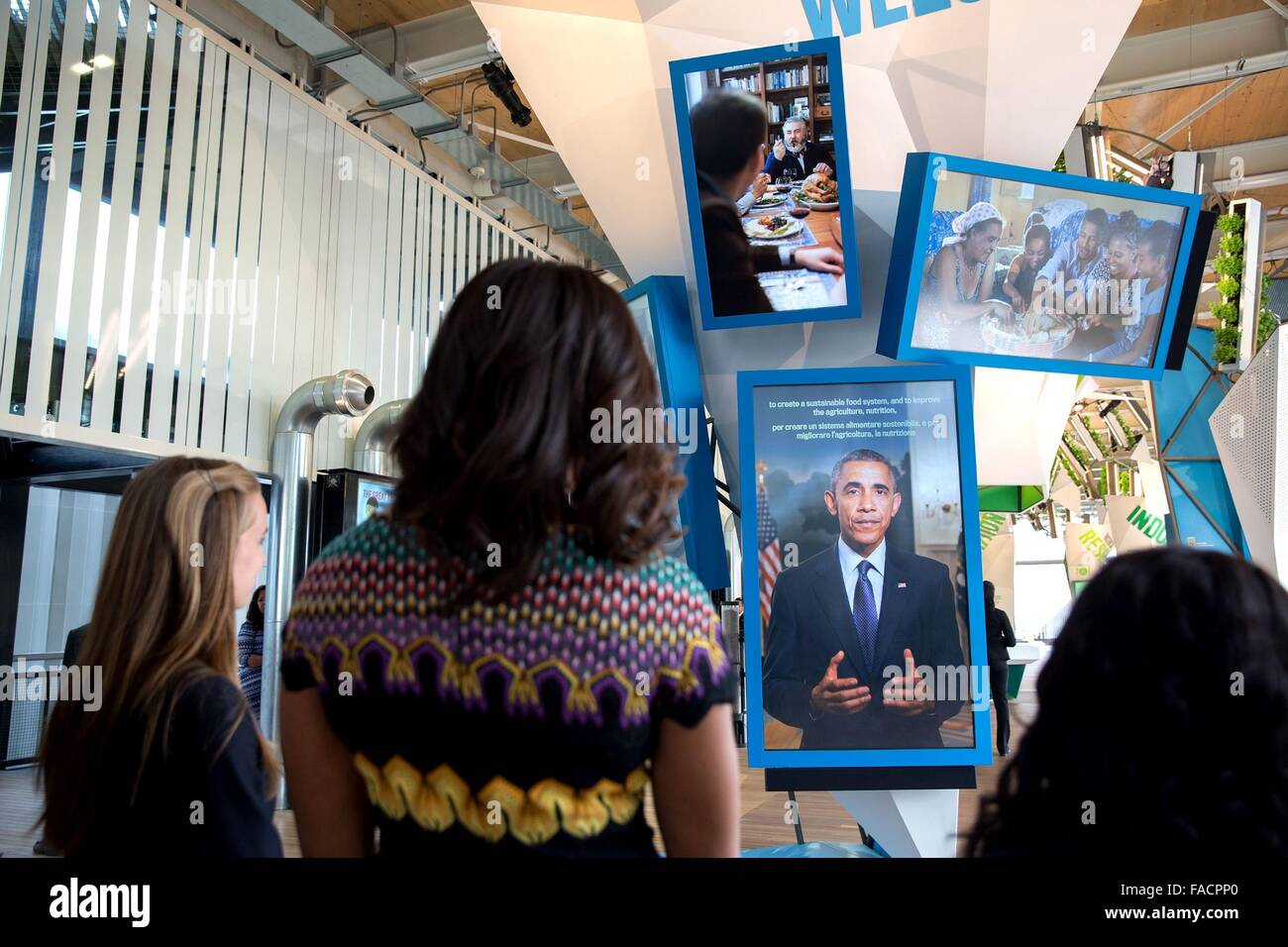 US First Lady Michelle Obama views her husband President Barack Obama on a video presentation in the USA Pavilion at the World Expo June 18, 2015 in Milan, Italy. Stock Photo