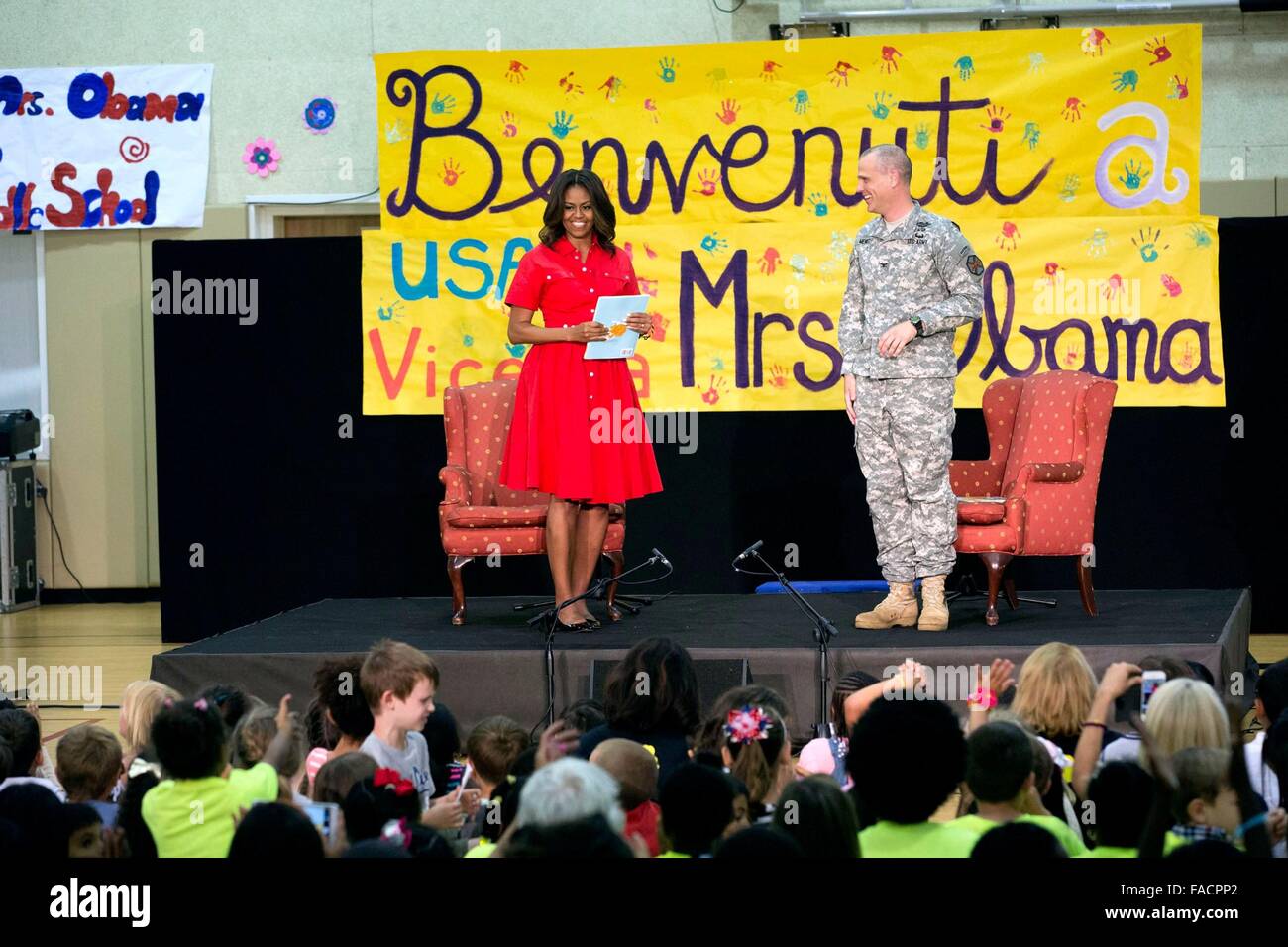 US First Lady Michelle Obama joins Col. Robert L. Menist, Jr. read to children of service members at U.S. Army Garrison Vicenza June 19, 2015 in Vicenza, Italy. Stock Photo