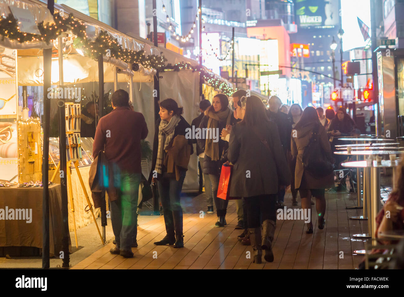 Shoppers walk through the Garment Center Holiday Market in New York on