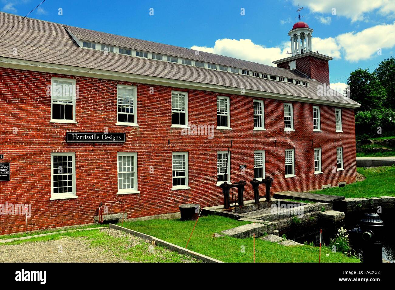 Harrisville, NH: Harrisville Designs at 1848 Mill Number One with its  distinctive bell tower and sluice gates * Stock Photo - Alamy