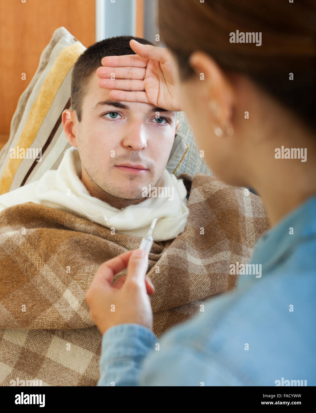 Loving husband caring sick wife hi-res stock photography and images - Alamy