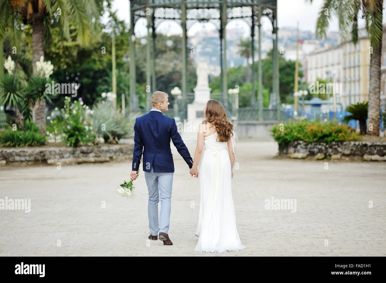 Two couple walking holding hands hi-res stock photography and images ...