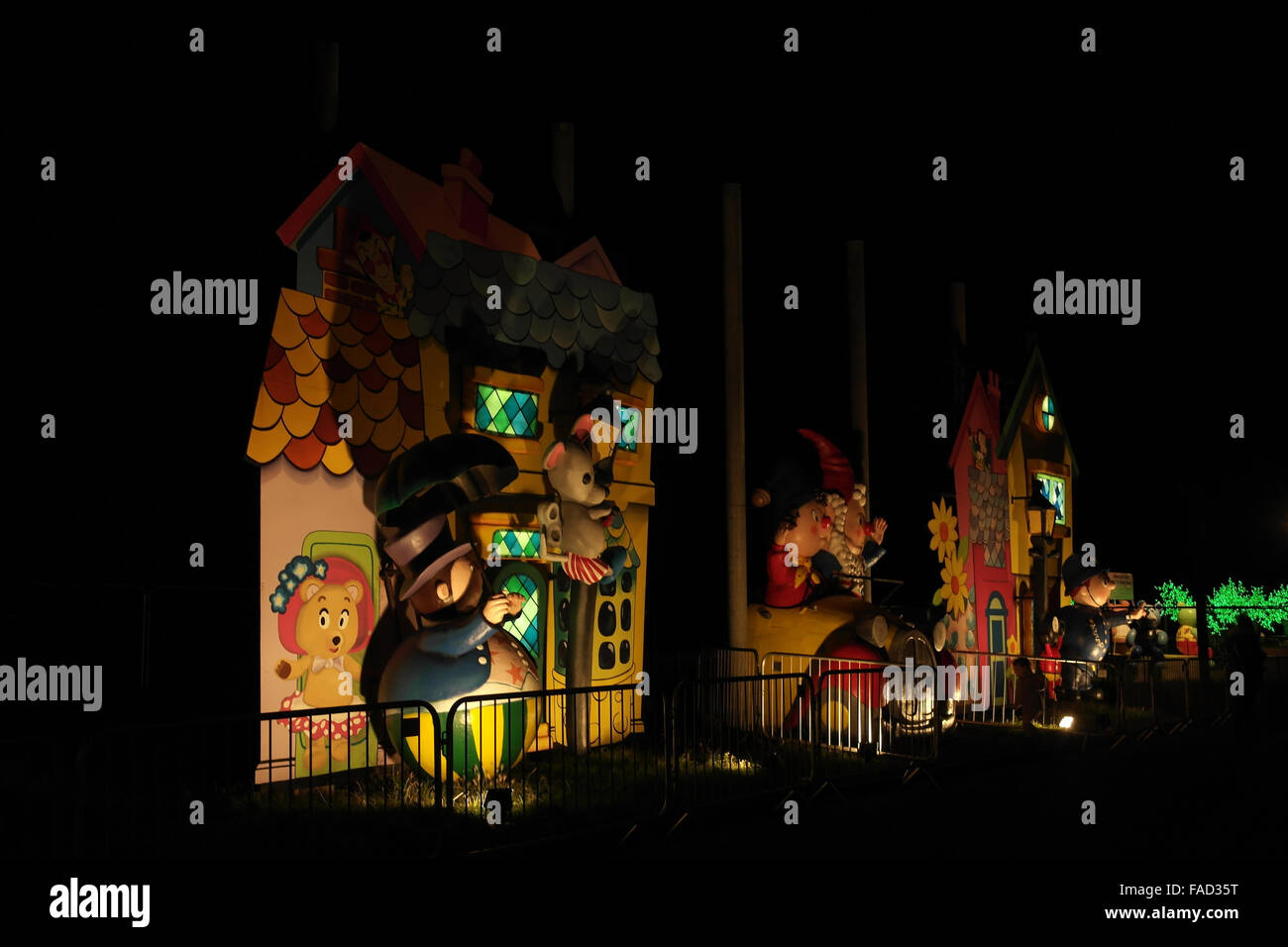 Night oblique view Toytown Mr Wobbly Man, PC Plod, Noddy and Big Ears sitting car, Noddy Tableau, Blackpool Illuminations, 2013 Stock Photo