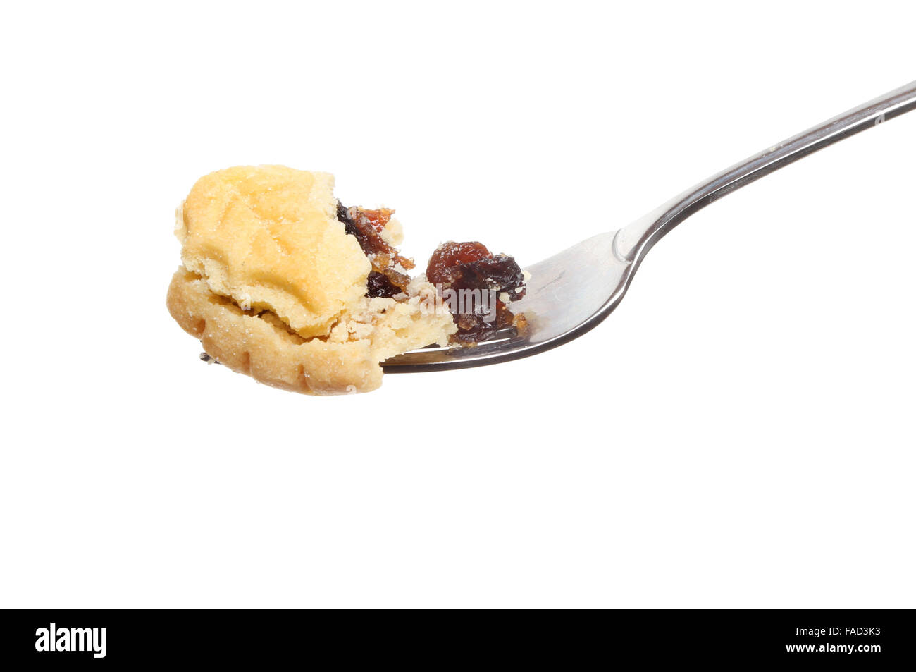 Mince pie on a fork isolated against white Stock Photo