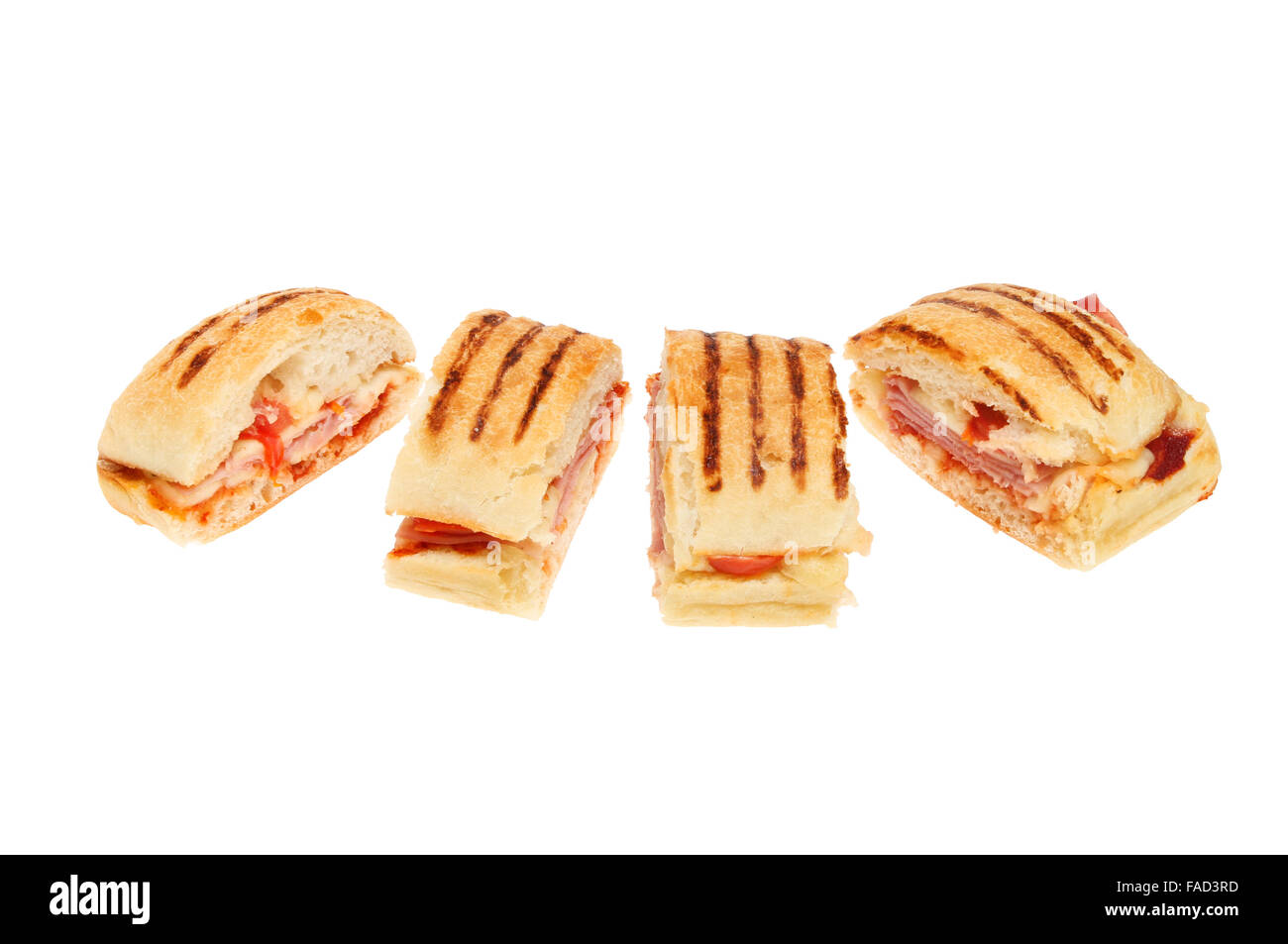 Slices of cheese, ham and tomato panini isolated against white Stock Photo