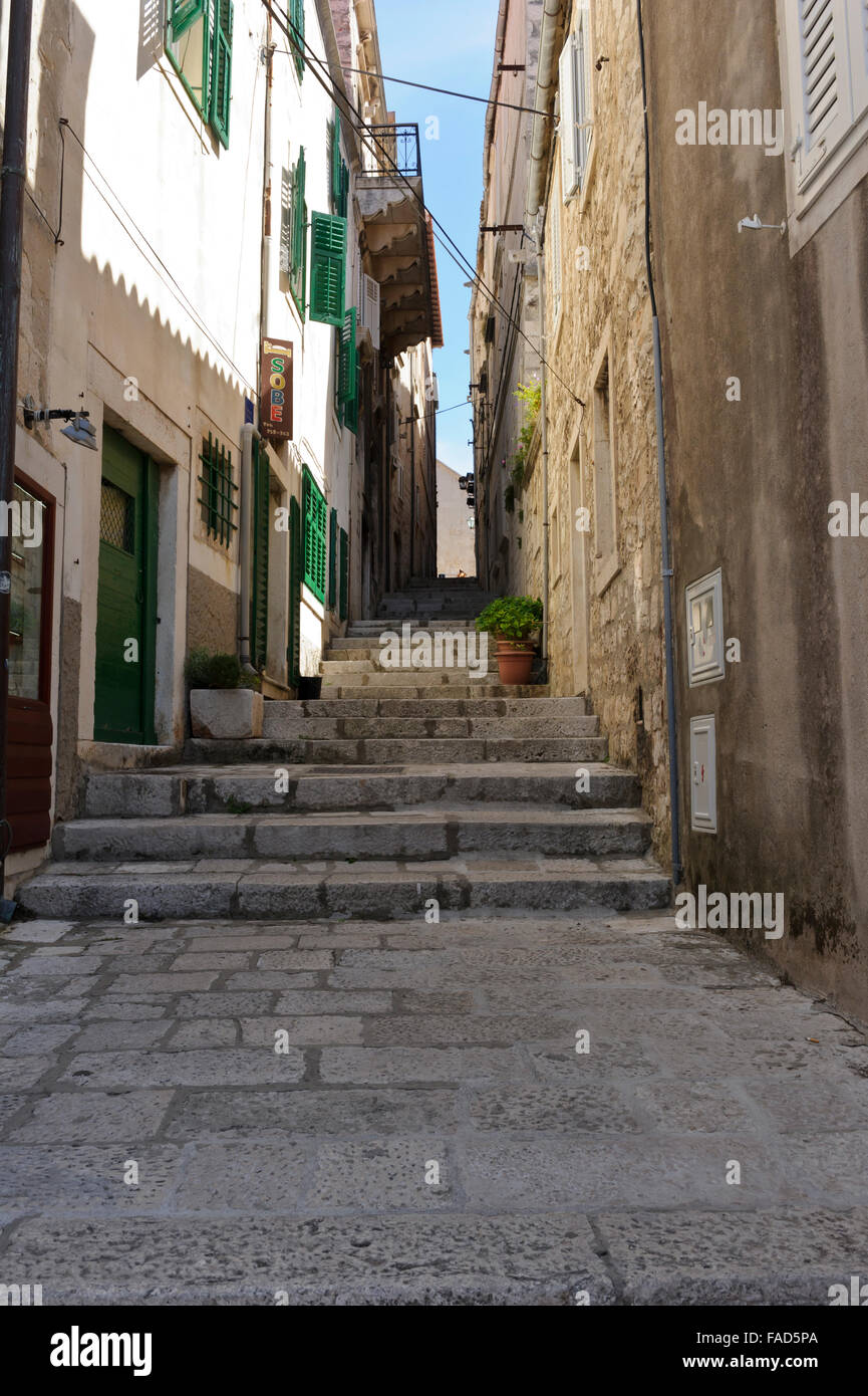 Image of Delivery of coal up steep steps in old part of