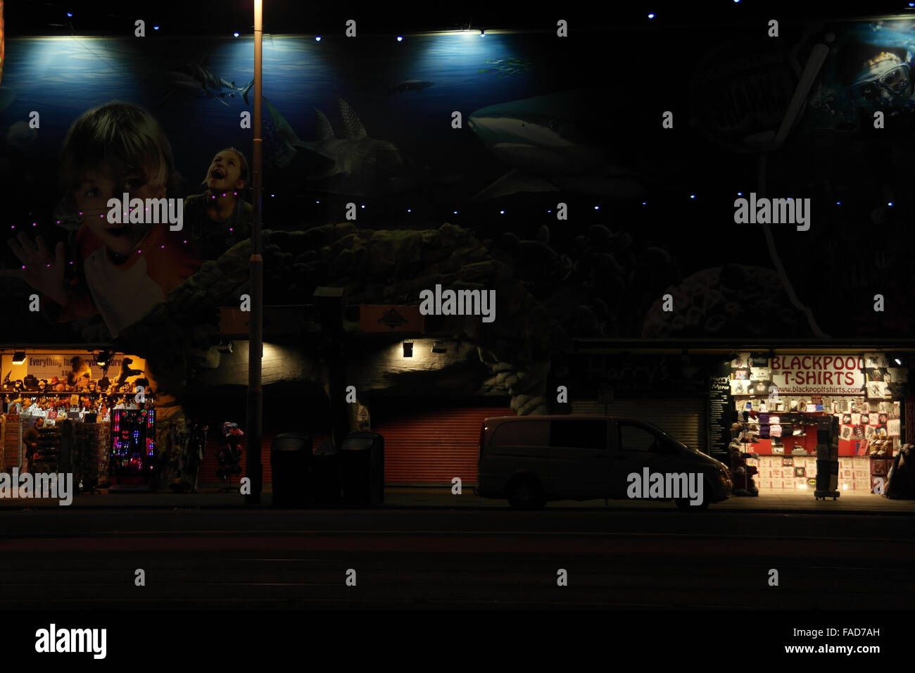 Night view, across the Central Promenade, to Tshirts and novelty shops