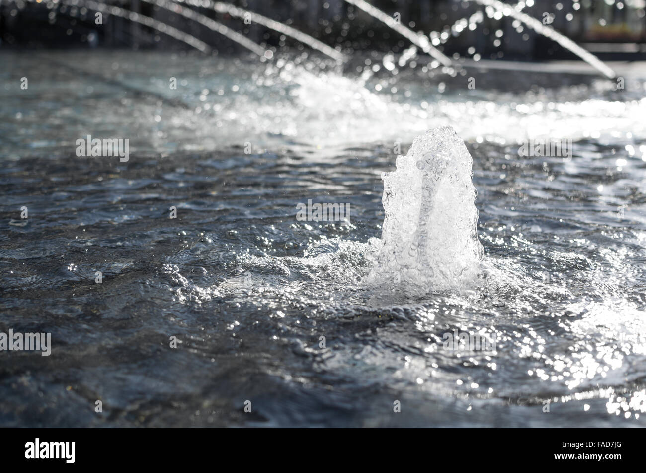 Splashing and Bubbling Fountain Water Closeup Stock Photo