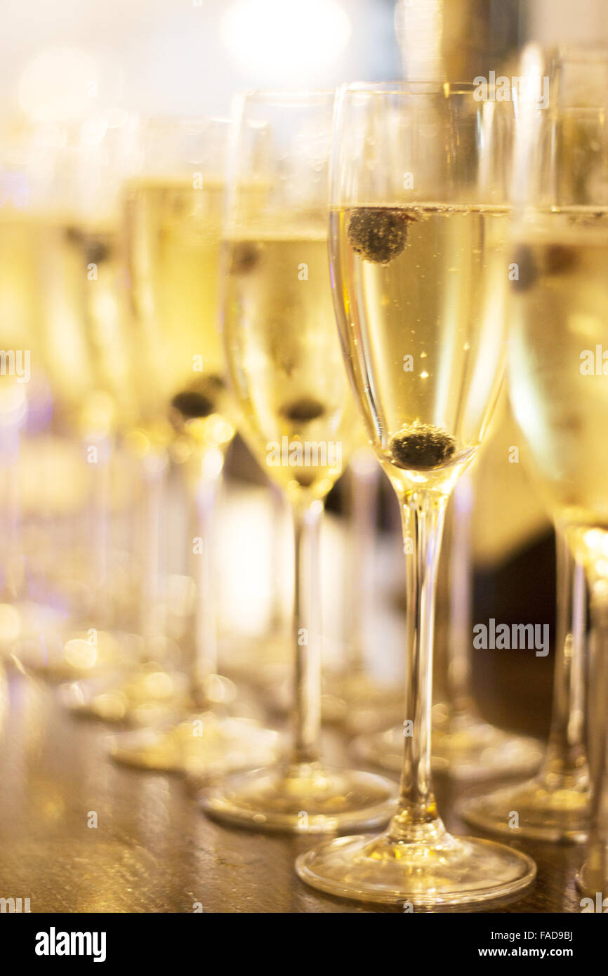 Champagne sparkling white wine glasses in restaurant bar in wedding reception party photo Stock