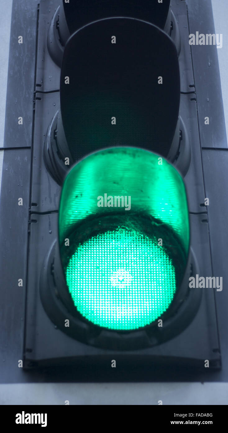 Green man go road traffic light sign Stock Photo - Alamy