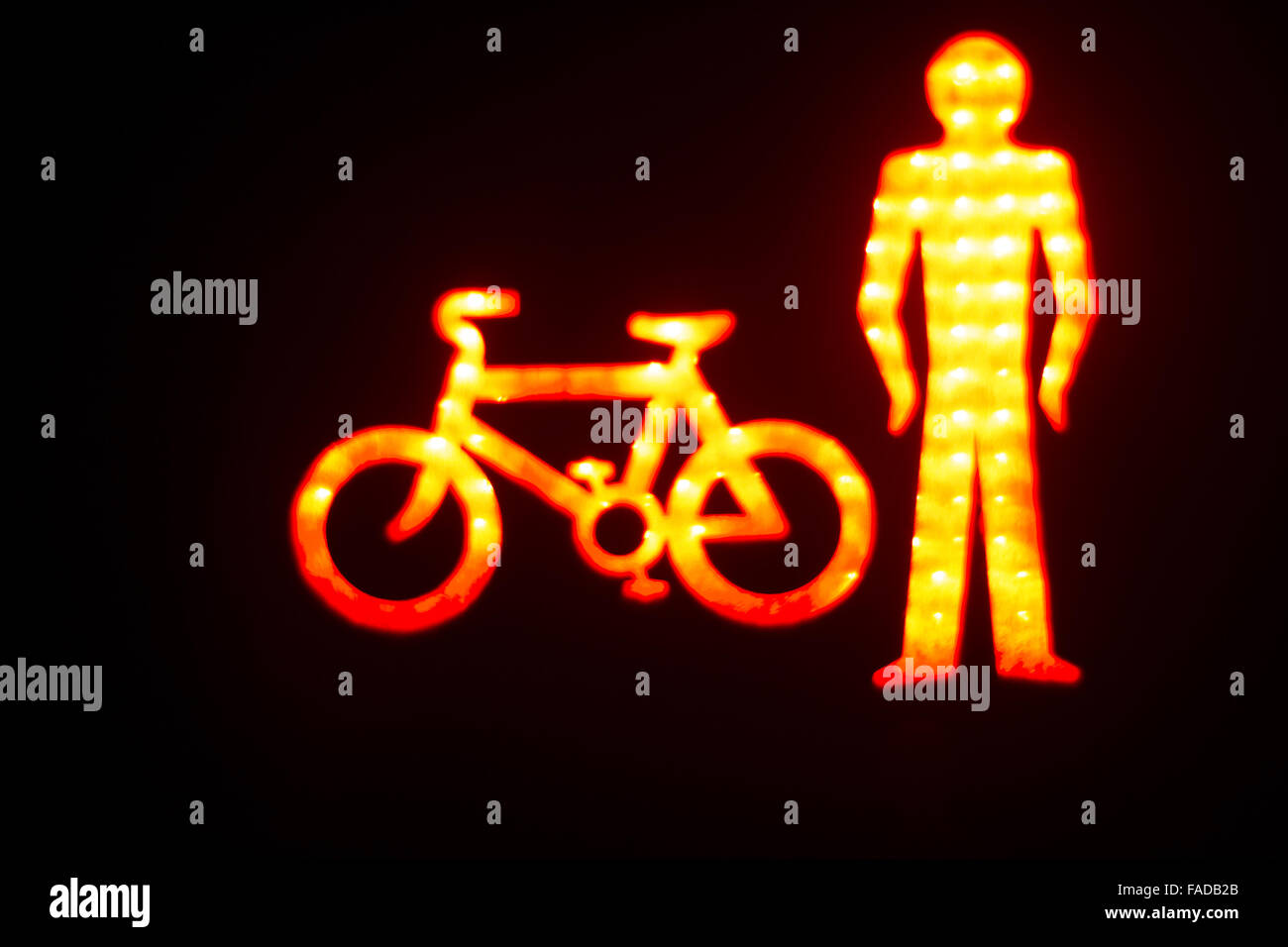 Green man go pedestrian and cycle traffic light sign Stock Photo - Alamy