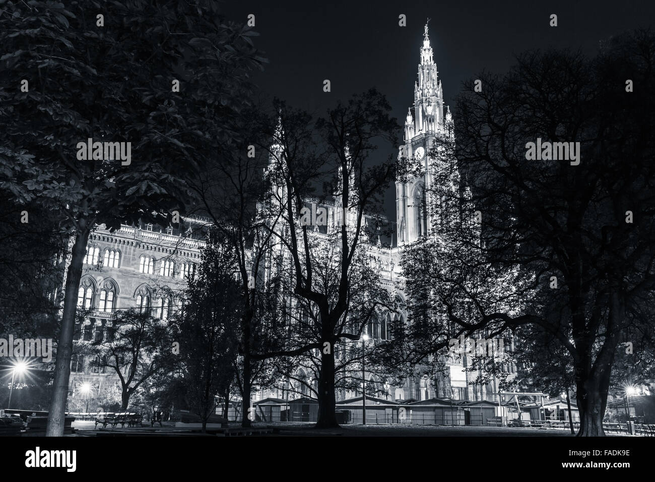 Rathaus of Vienna at night. Town Hall building with illumination, blue toned monochrome photo Stock Photo
