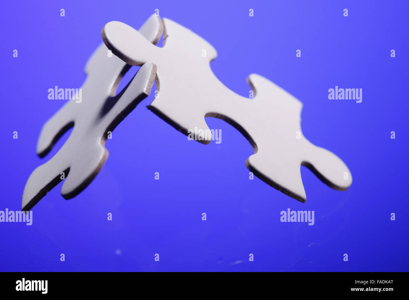 Two jigsaw puzzle parts joined together Stock Photo Alamy