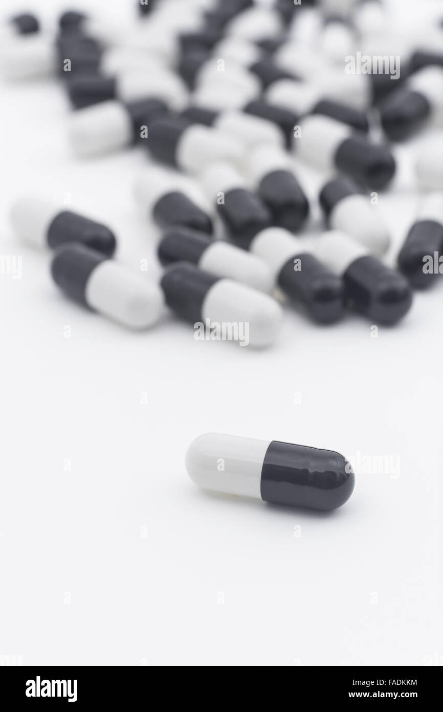 Closeup of pills capsule form made of gelatin. Big Pharma concept