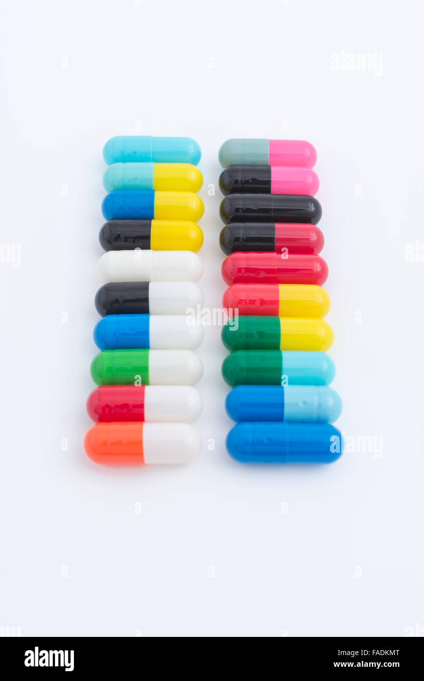 Close-up pills - capsules made of gelatin. Metaphor consumer choice, variety, market share, diversification, diversity, Big Pharma, drug trials. Stock Photo