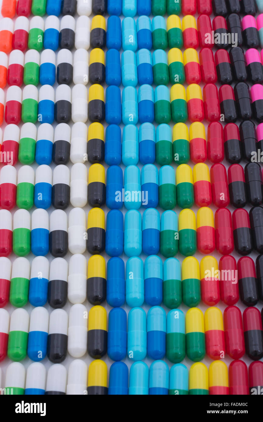 Close-up pills - capsules made of gelatin. Metaphor consumer choice,  variety, market share, diversification, diversity, Big Pharma, drug trials. Stock Photo