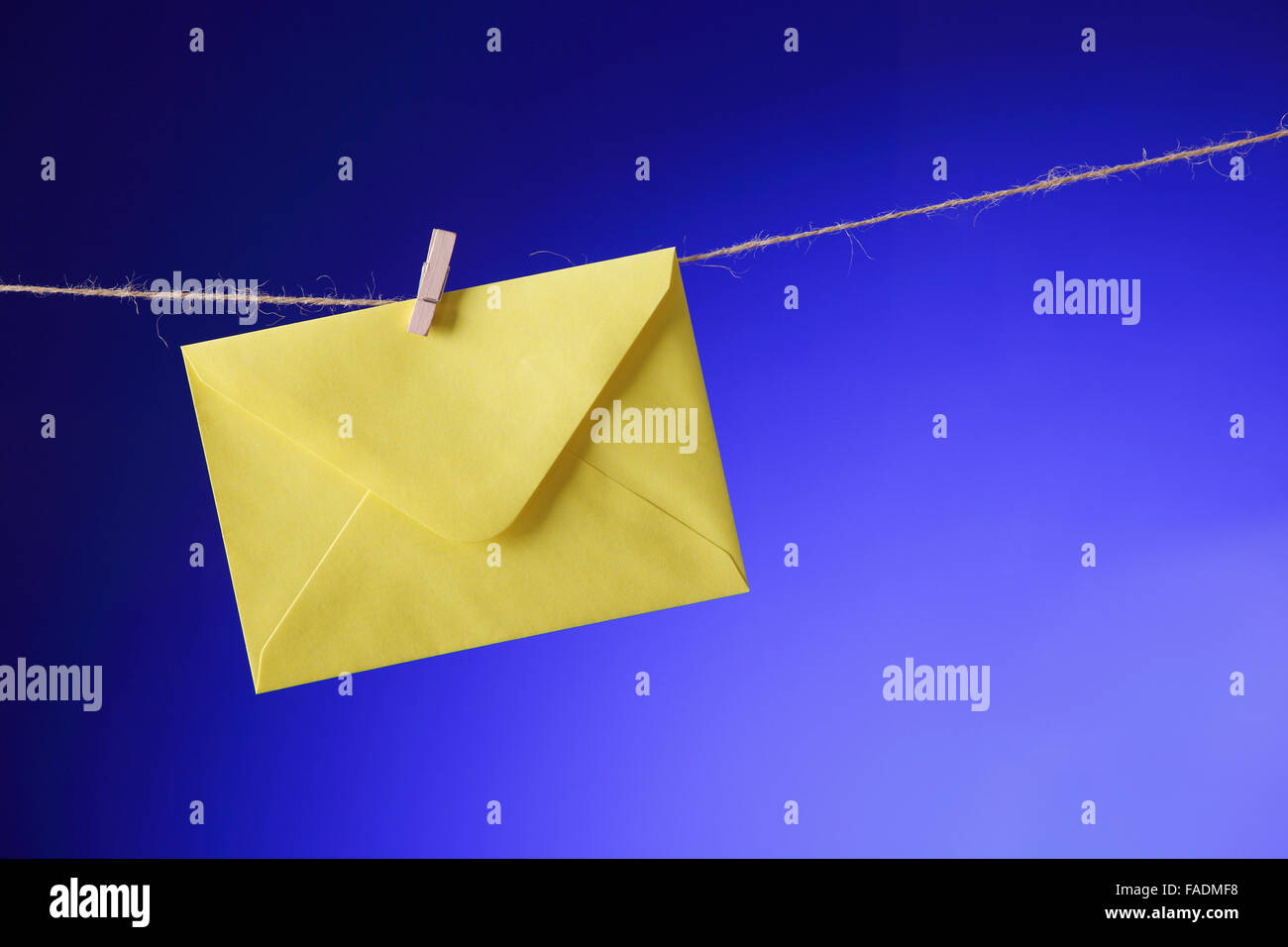 Close up on yellow Envelope on clothes line Stock Photo Alamy