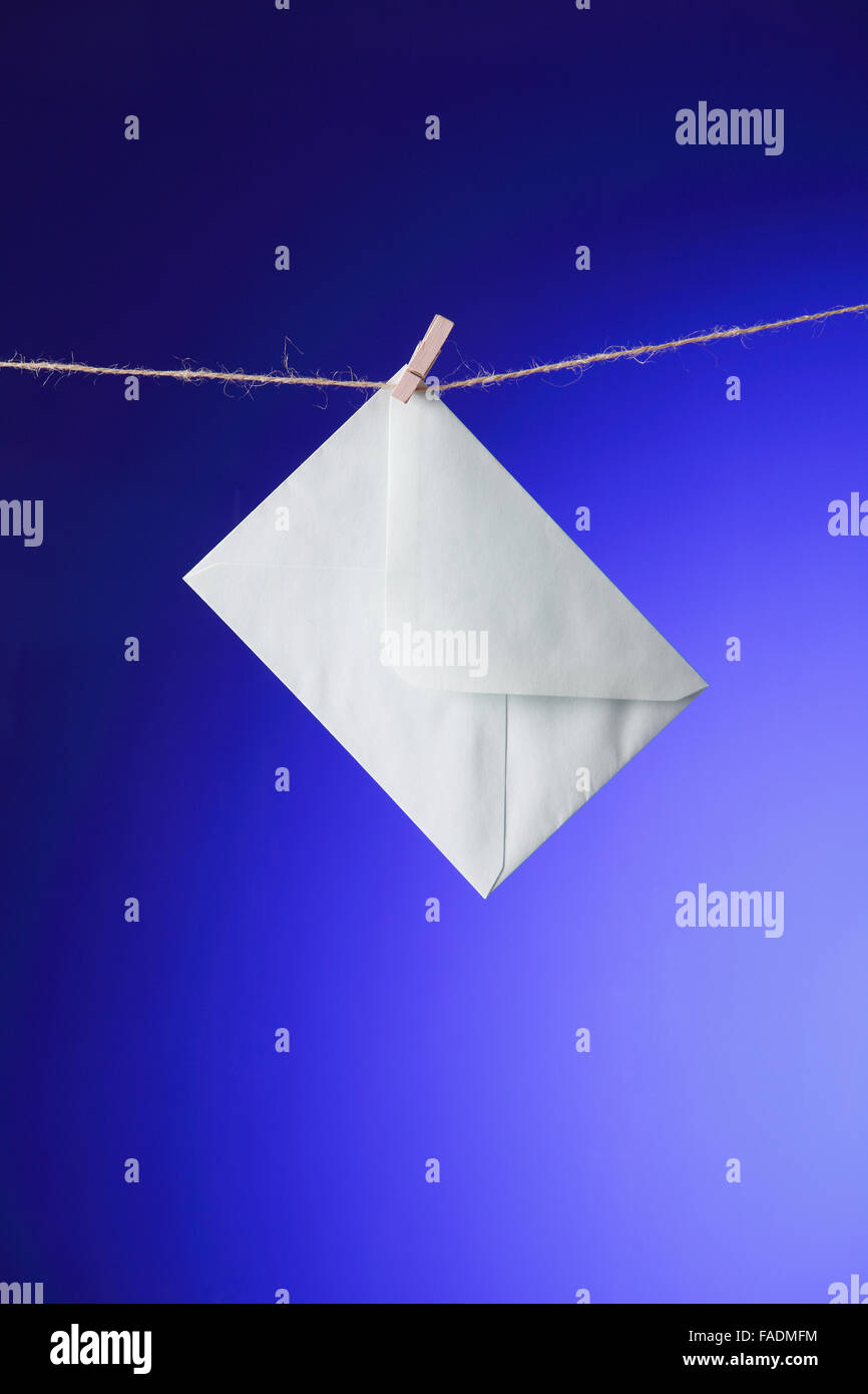 white Envelope on clothes line Stock Photo Alamy
