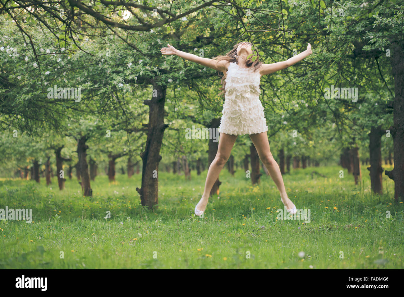 Girl are jumping in the park Stock Photo - Alamy