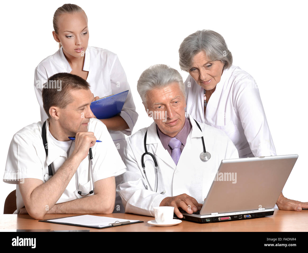 Doctors at the table on white background Stock Photo - Alamy