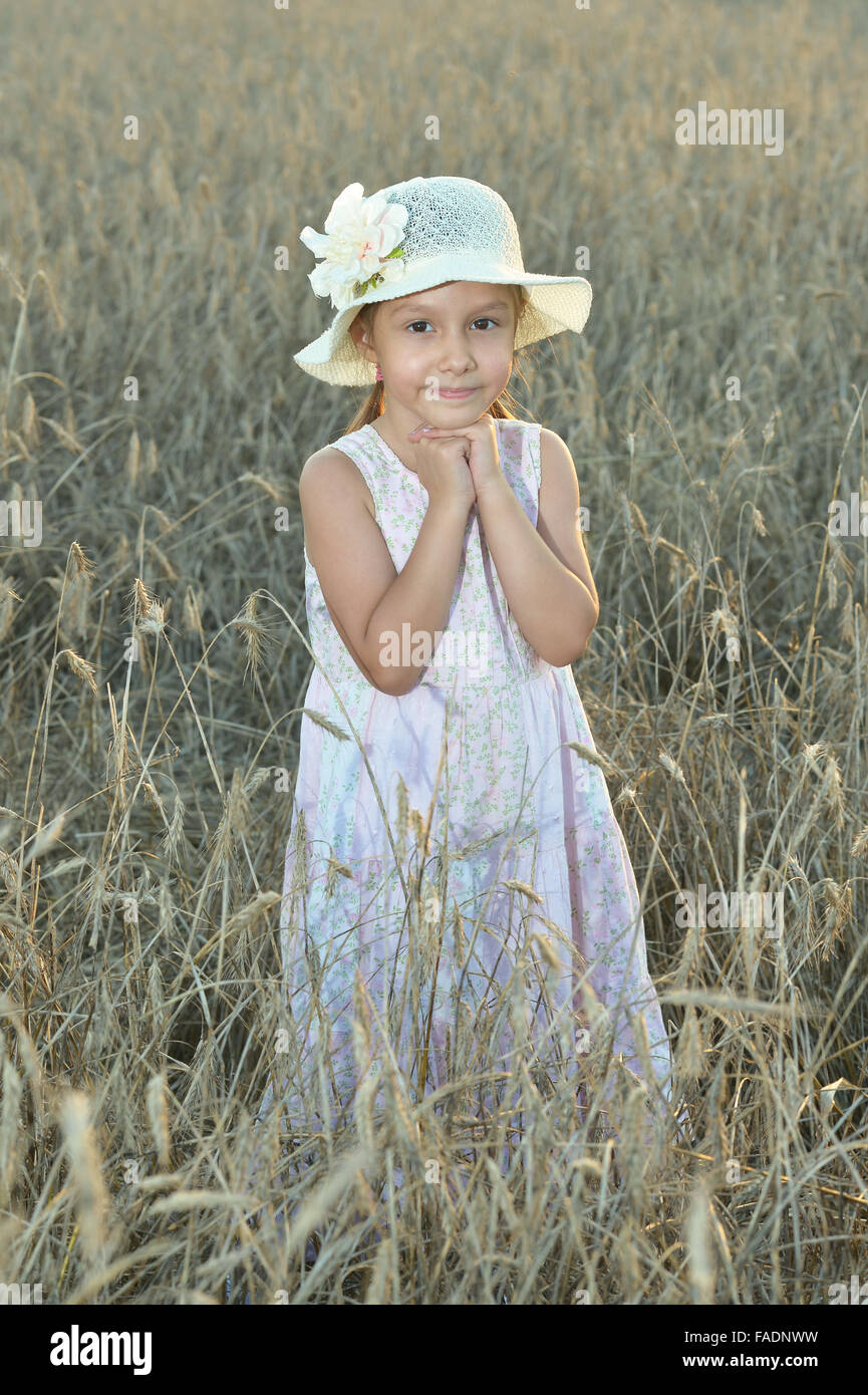 Little girl in wheat field Stock Photo - Alamy