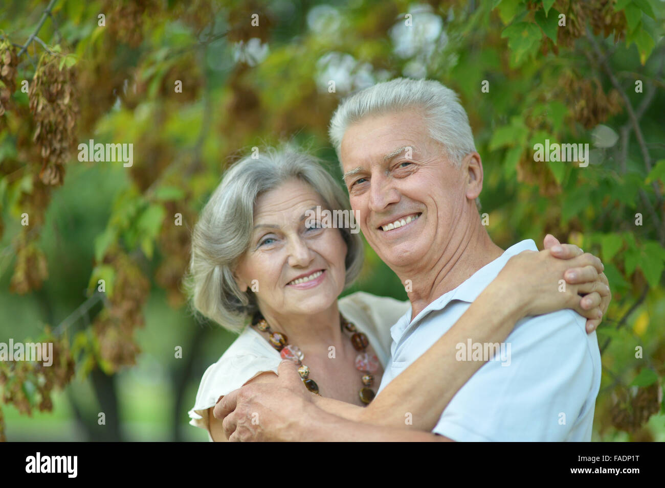 Senior couple in autumn park Stock Photo - Alamy