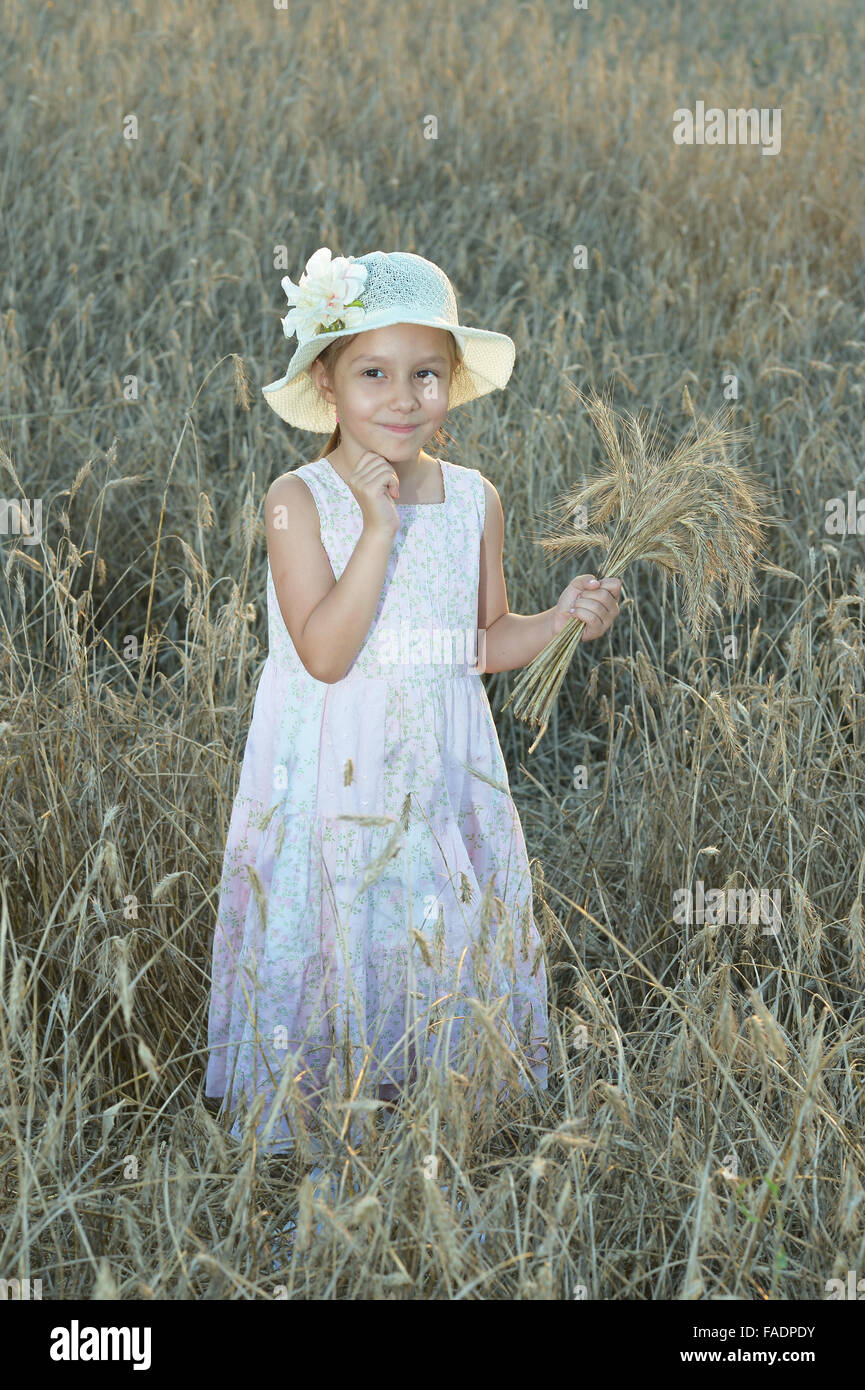 Little girl in wheat field Stock Photo - Alamy