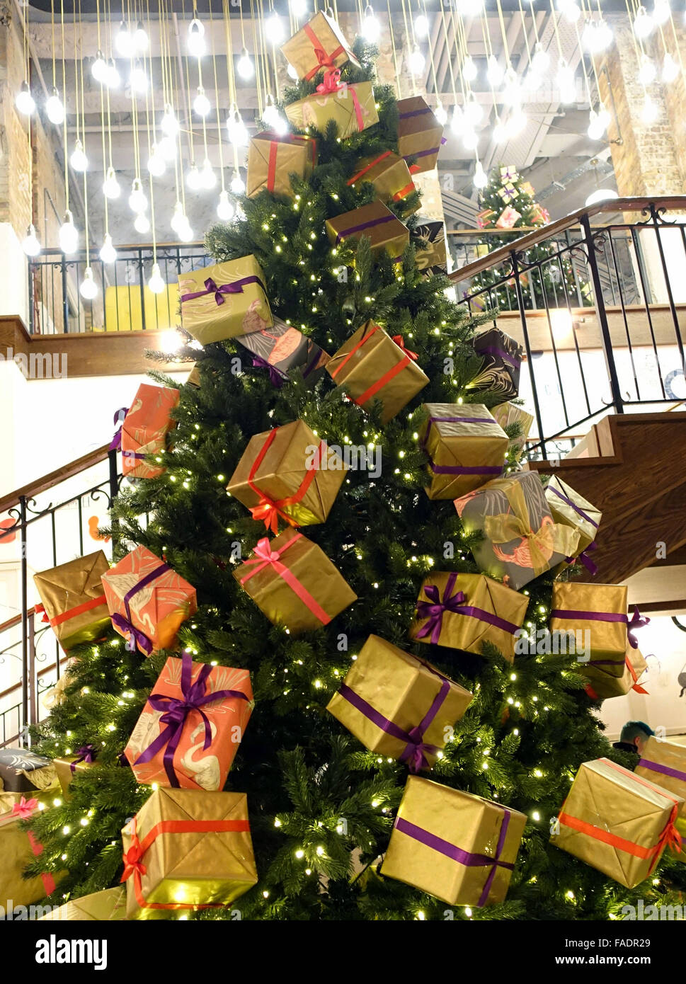 Christmas tree with presents in West End cinema, London Stock Photo Alamy