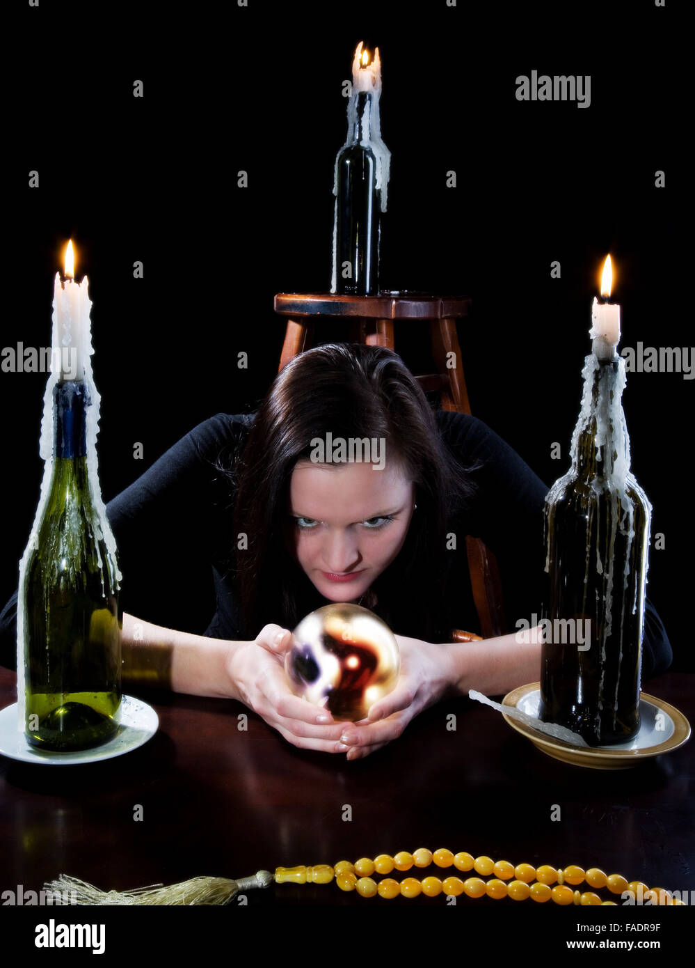 She read the black background with candle Stock Photo